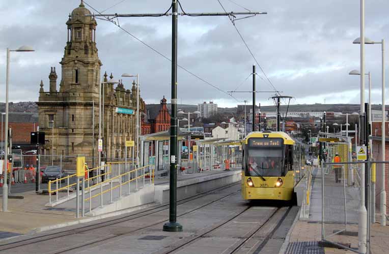 Oldham and tram celebtrating more homes in oldham to get full fibre broadband